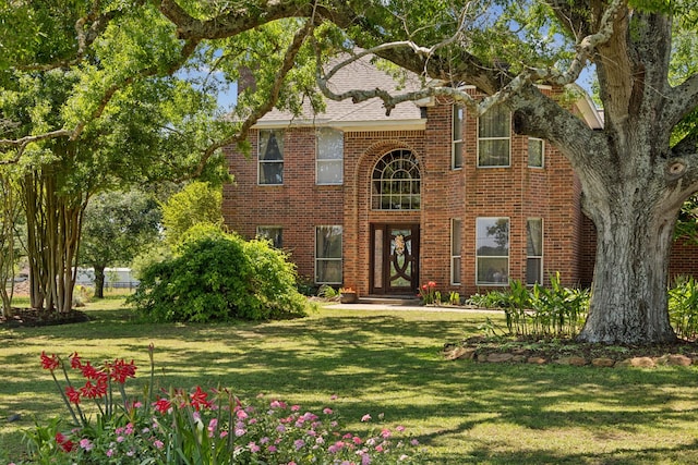17207 Penick Rd, Waller, TX 77484 - view of front of home featuring a front yard and brick siding