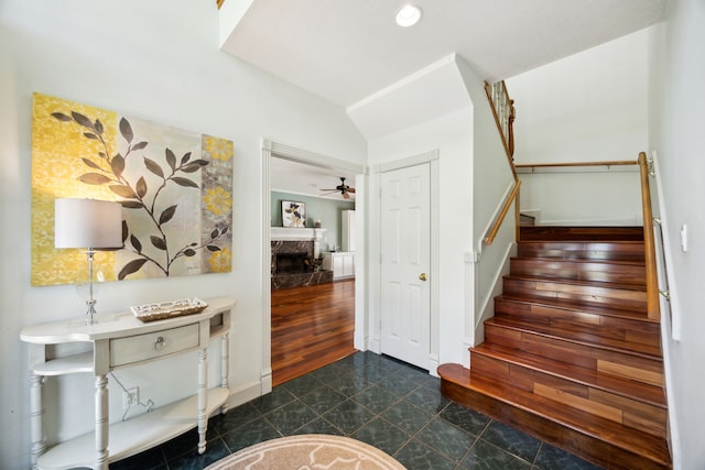 17207 Penick Rd, Waller, TX 77484 - stairway featuring a premium fireplace, ceiling fan, and recessed lighting