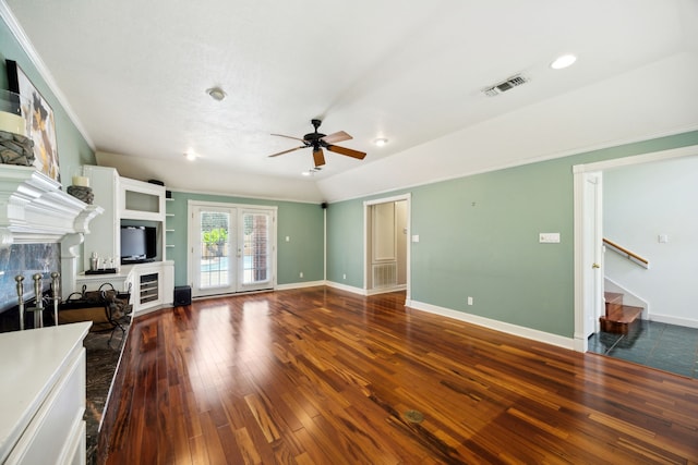 17207 Penick Rd, Waller, TX 77484 - unfurnished living room featuring a ceiling fan, a tiled fireplace, wood-type flooring, baseboards, and recessed lighting