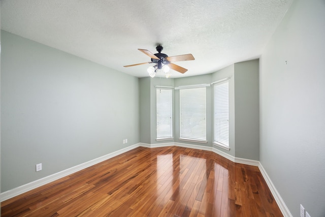 17207 Penick Rd, Waller, TX 77484 - spare room with baseboards, a ceiling fan, hardwood / wood-style flooring, and a textured ceiling