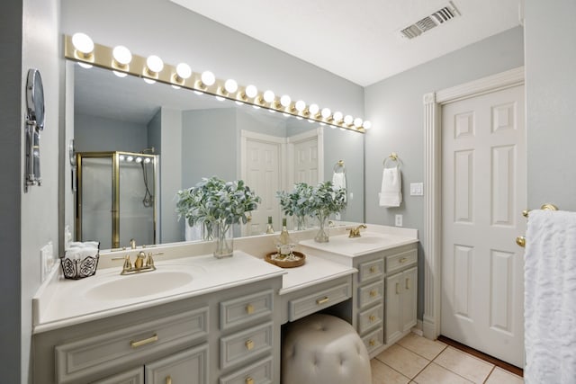 17207 Penick Rd, Waller, TX 77484 - bathroom with double vanity, tile patterned flooring, and a stall shower