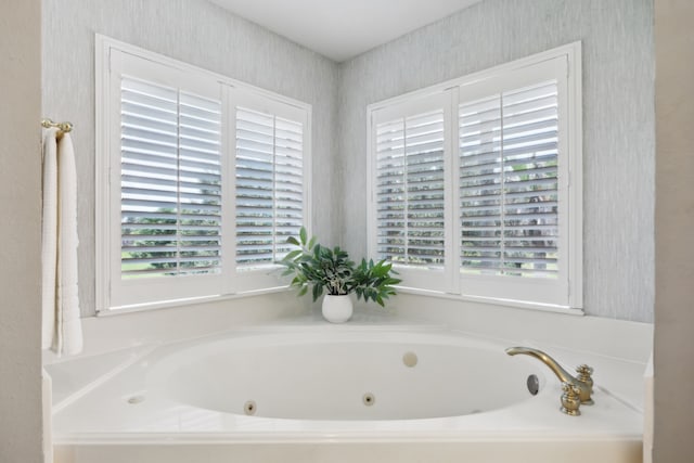 17207 Penick Rd, Waller, TX 77484 - bathroom with wallpapered walls, plenty of natural light, and a tub with jets