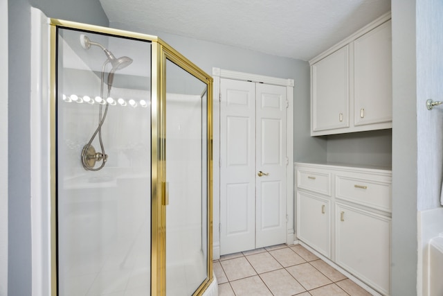 17207 Penick Rd, Waller, TX 77484 - bathroom with a shower stall and tile patterned flooring