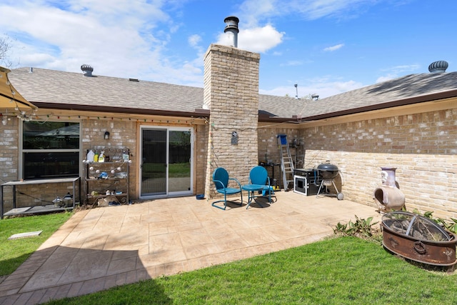 view of patio featuring area for grilling and a fire pit