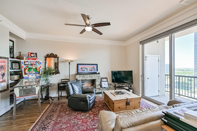 3333 Allen Pkwy Unit 1804, Houston, TX 77019 - living area featuring crown molding, ceiling fan, wood finished floors, a brick fireplace, and baseboards