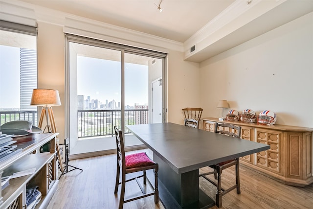 3333 Allen Pkwy Unit 1804, Houston, TX 77019 - dining room with ornamental molding, light wood-type flooring, and a view of skyline