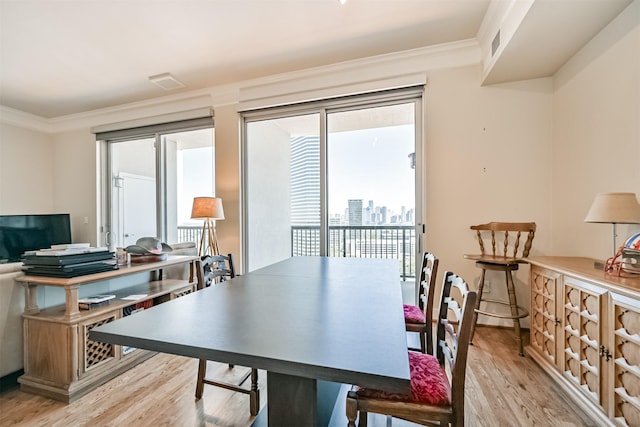 3333 Allen Pkwy Unit 1804, Houston, TX 77019 - dining room with light wood finished floors and ornamental molding