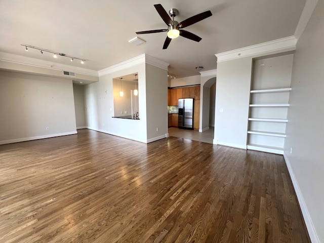 3333 Allen Pkwy Unit 1804, Houston, TX 77019 - unfurnished living room featuring a ceiling fan, arched walkways, crown molding, track lighting, and dark wood-type flooring