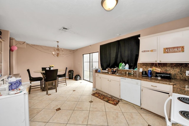 12041 Willow Trl, Houston, TX 77035 - kitchen with dishwasher, stove, tasteful backsplash, dark countertops, and white cabinetry