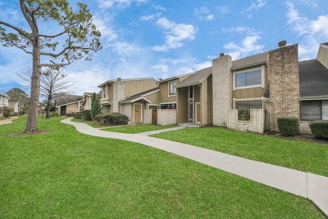 12041 Willow Trl, Houston, TX 77035 - view of front of property with a chimney, a front lawn, a residential view, and roof with shingles