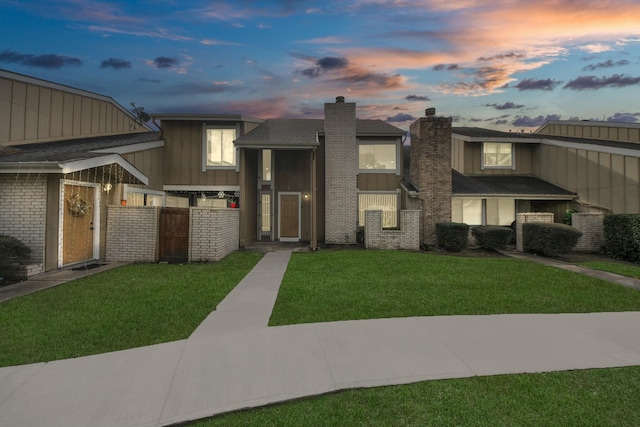 12041 Willow Trl, Houston, TX 77035 - view of front of property with a chimney, board and batten siding, and a front lawn