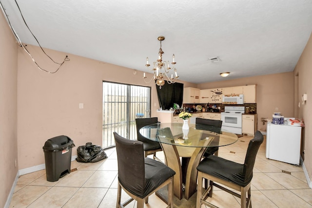 12041 Willow Trl, Houston, TX 77035 - dining room with a chandelier and light tile patterned flooring