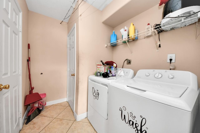 12041 Willow Trl, Houston, TX 77035 - laundry room with independent washer and dryer and light tile patterned floors