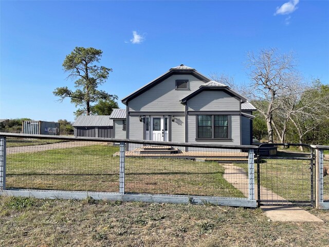 134 E N St, Goliad, TX 77963 - view of front of property with a gate and a fenced front yard