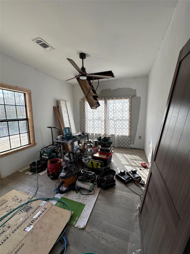 134 E N St, Goliad, TX 77963 - interior space with wood finished floors and a ceiling fan