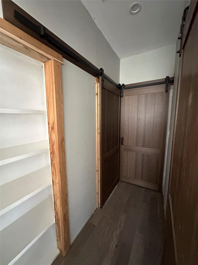 134 E N St, Goliad, TX 77963 - hall with a barn door and wood finished floors