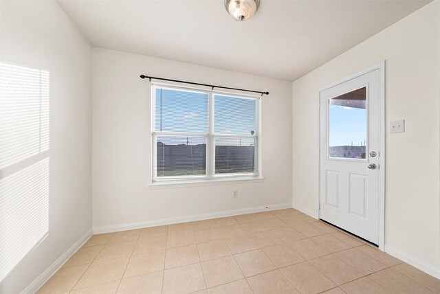 6906 Chessgate Falls Ln, Rosenberg, TX 77469 - spare room featuring baseboards and light tile patterned floors