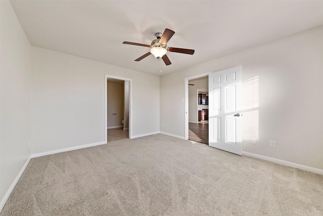 6906 Chessgate Falls Ln, Rosenberg, TX 77469 - unfurnished bedroom featuring a ceiling fan, light carpet, and baseboards