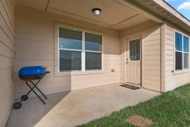 6906 Chessgate Falls Ln, Rosenberg, TX 77469 - view of exterior entry featuring a patio area