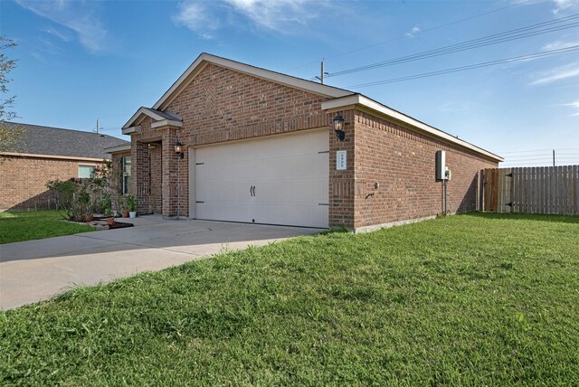 6906 Chessgate Falls Ln, Rosenberg, TX 77469 - view of property exterior featuring fence, driveway, brick siding, a garage, and a lawn