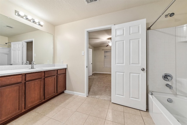 6906 Chessgate Falls Ln, Rosenberg, TX 77469 - bathroom featuring tile patterned floors, bathing tub / shower combination, a ceiling fan, vanity, and a textured ceiling