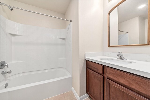 6906 Chessgate Falls Ln, Rosenberg, TX 77469 - full bath with tile patterned flooring, vanity, baseboards, and bathtub / shower combination