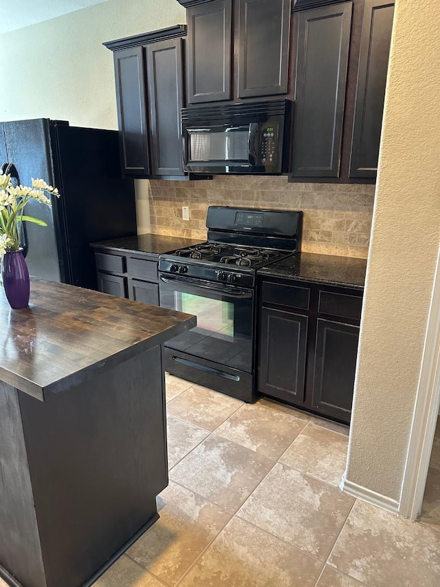 13830 Bonner Bluff Ln, Houston, TX 77047 - kitchen with tasteful backsplash, wooden counters, baseboards, a textured wall, and black appliances