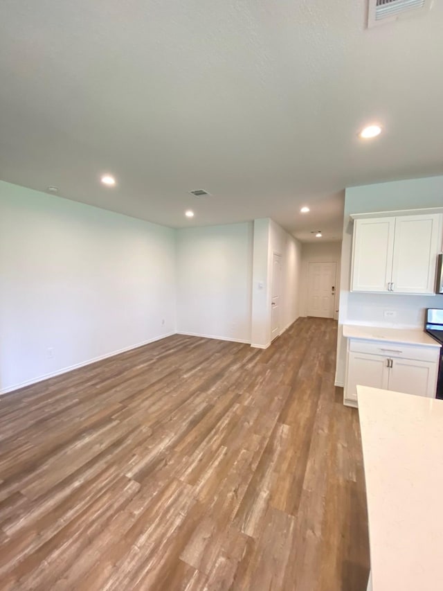 unfurnished living room featuring visible vents, recessed lighting, and light wood finished floors