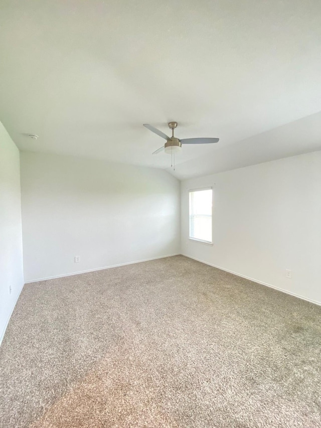 unfurnished room with ceiling fan, baseboards, and carpet floors