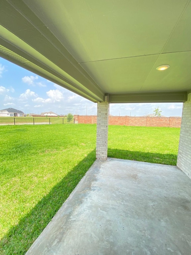 view of yard with a patio and fence