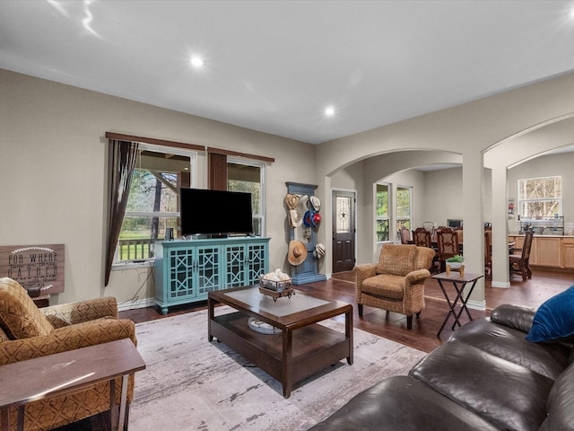 1151 County Line Rd, Shepherd, TX 77371 - living area featuring recessed lighting, wood finished floors, arched walkways, and a wealth of natural light
