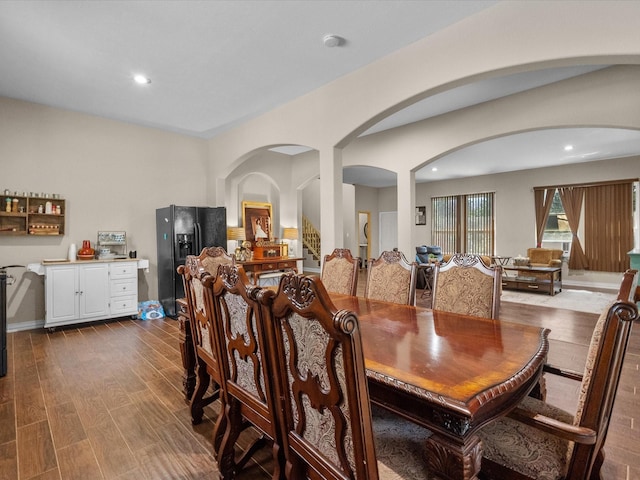1151 County Line Rd, Shepherd, TX 77371 - dining room featuring dark wood finished floors, recessed lighting, and arched walkways