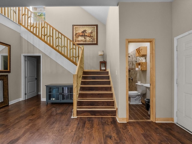 1151 County Line Rd, Shepherd, TX 77371 - stairway with baseboards and wood finished floors