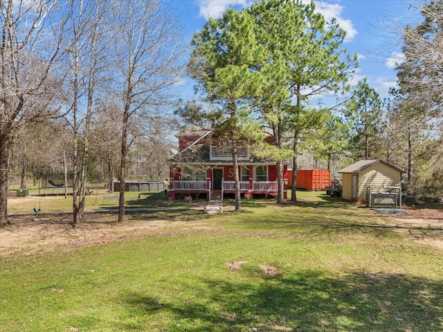 1151 County Line Rd, Shepherd, TX 77371 - view of yard with a wooden deck and an outdoor structure