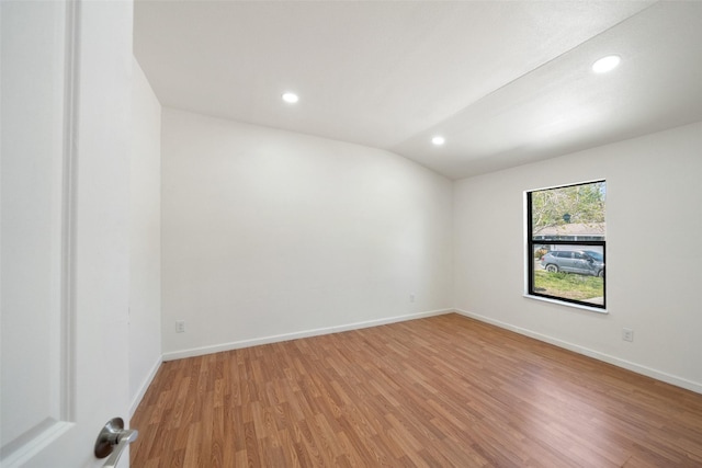 5610 Belarbor St, Houston, TX 77033 - empty room featuring vaulted ceiling, light wood-style flooring, recessed lighting, and baseboards