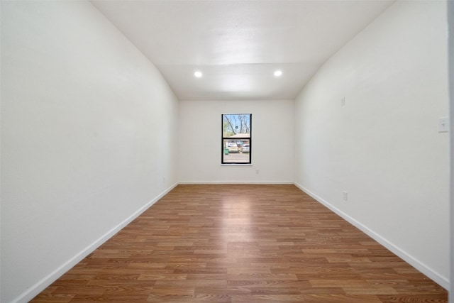 5610 Belarbor St, Houston, TX 77033 - empty room with recessed lighting, baseboards, and wood finished floors