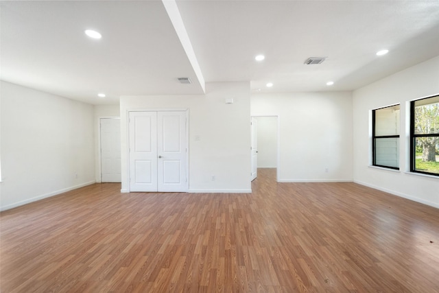 5610 Belarbor St, Houston, TX 77033 - unfurnished room with recessed lighting, visible vents, baseboards, and light wood-style floors
