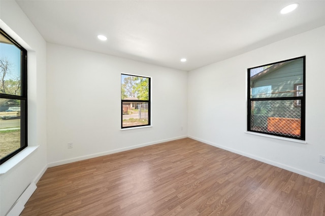 5610 Belarbor St, Houston, TX 77033 - spare room with recessed lighting, baseboards, and wood finished floors