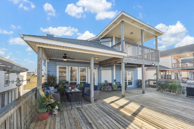deck with ceiling fan, a grill, and outdoor lounge area