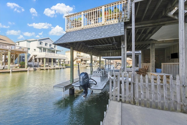 view of dock featuring a water view and boat lift