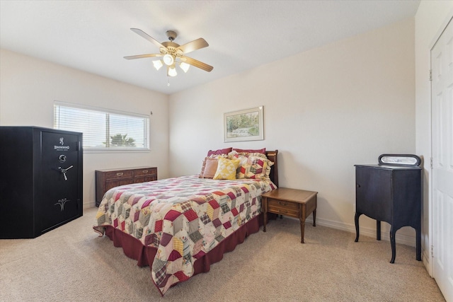 carpeted bedroom featuring a ceiling fan and baseboards