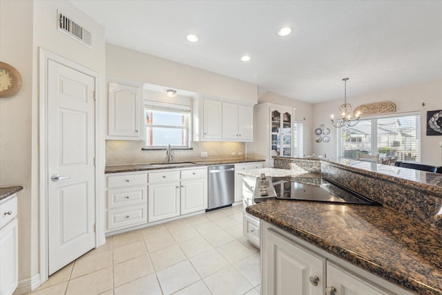 kitchen featuring an inviting chandelier, a sink, dishwasher, visible vents, and pendant lighting
