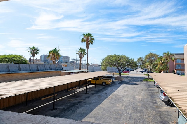 215 Postoffice St Unit 702, Galveston, TX 77550 - view of partially covered parking lot