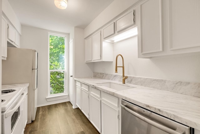 215 Postoffice St Unit 702, Galveston, TX 77550 - kitchen featuring white range with electric cooktop, stainless steel dishwasher, a sink, dark wood-type flooring, and white cabinetry