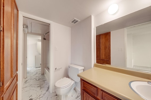 215 Postoffice St Unit 702, Galveston, TX 77550 - bathroom featuring marble finish floors, vanity, toilet, and shower / tub combination