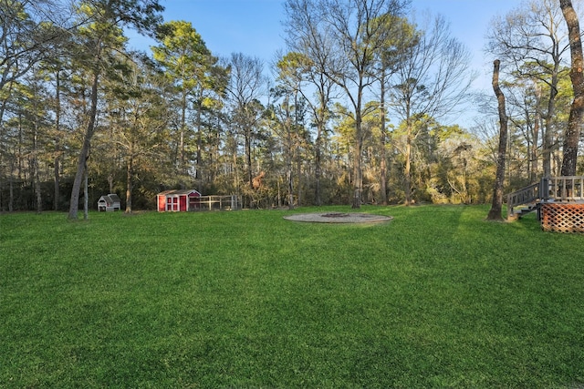 1518 Honea Egypt Rd, Magnolia, TX 77354 - view of yard with an outbuilding and an outdoor fire pit