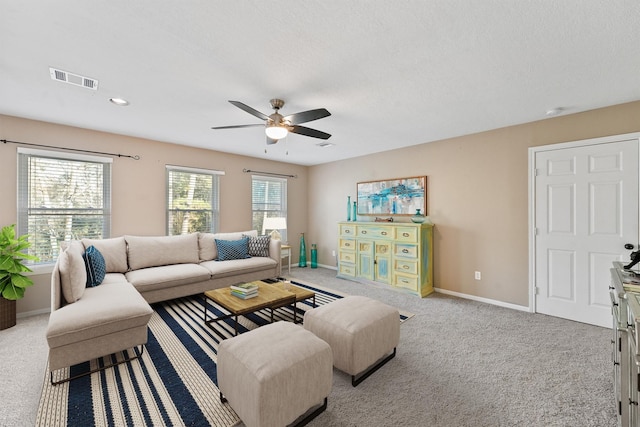 1518 Honea Egypt Rd, Magnolia, TX 77354 - living room with ceiling fan, carpet, a textured ceiling, visible vents, and baseboards