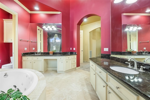 843 Royal Lakes Blvd, Richmond, TX 77469 - full bathroom with ornamental molding, a jetted tub, toilet, and a sink
