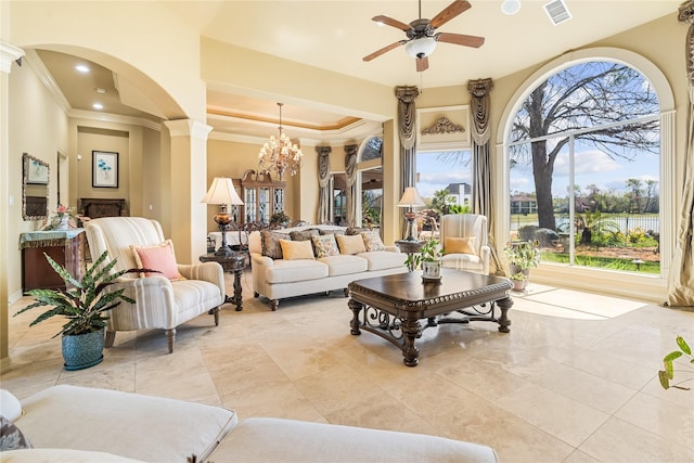 843 Royal Lakes Blvd, Richmond, TX 77469 - living room featuring visible vents, ceiling fan with notable chandelier, arched walkways, crown molding, and a raised ceiling
