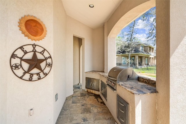 843 Royal Lakes Blvd, Richmond, TX 77469 - view of patio / terrace with grilling area, exterior kitchen, and fence